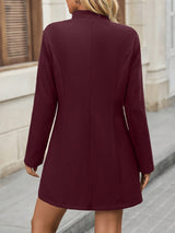 Cappotto elegante con colletto dritto e bottoni classici